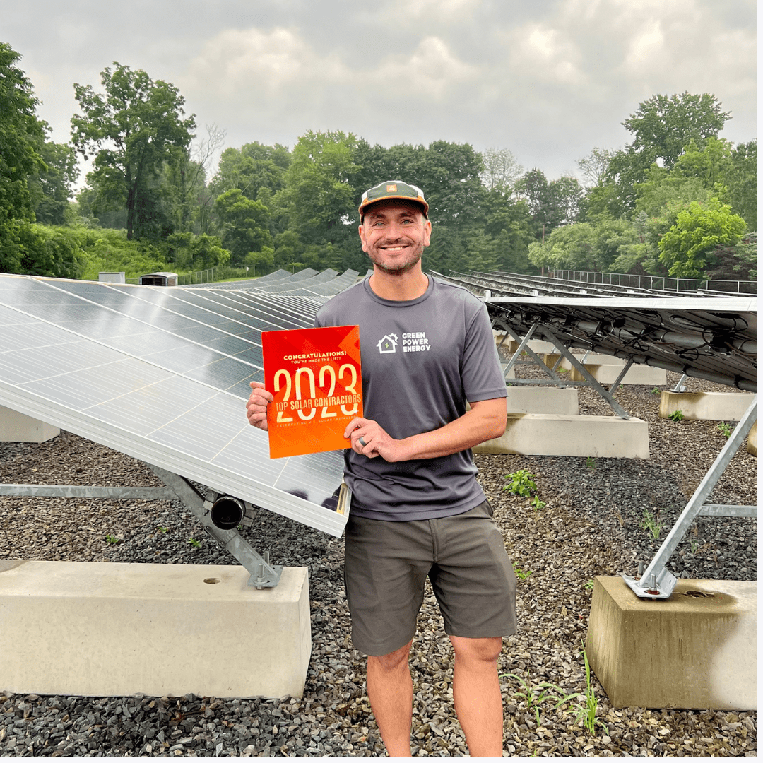 Andrew Contrion VP of Marketing holding the 2023 Top Solar Contractor awards